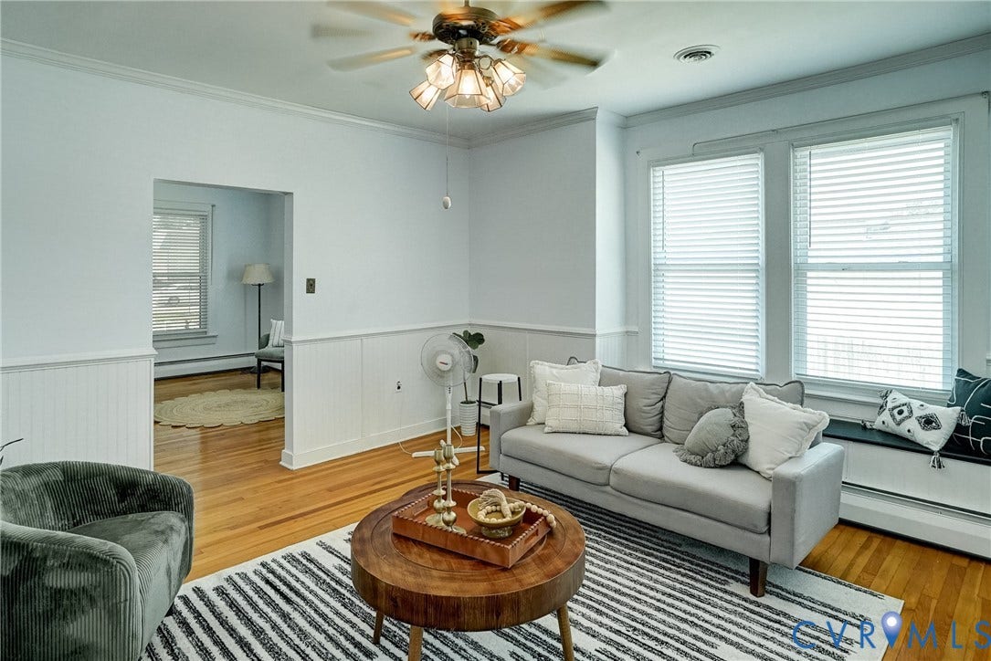 Hardwood flooring, and an overhead ceiling fan
