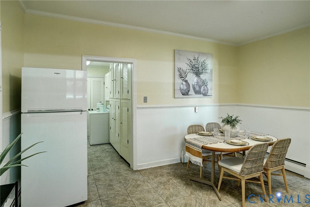 White paneled, light-toned wall paint, and tiled flooring