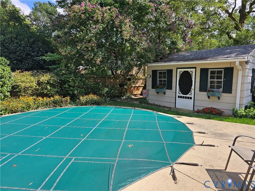 10205 Gwynnbrook Road, Richmond, VA 23235 Paved patio area with a covered pool and surrounding landscaping