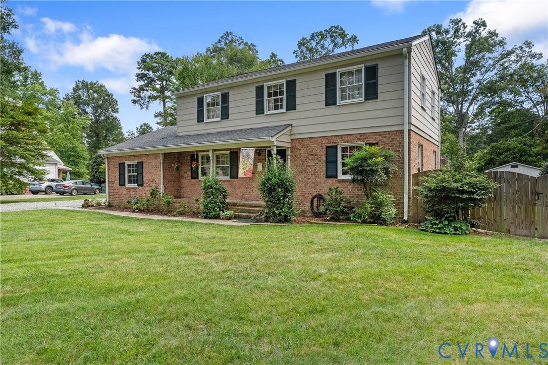 10205 Gwynnbrook Road, Richmond, VA 23235 Brick and siding exterior with a covered front porch and dark shutters
