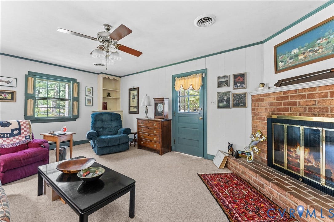 10205 Gwynnbrook Road, Richmond, VA 23235 Brick fireplace with a metal and glass enclosure