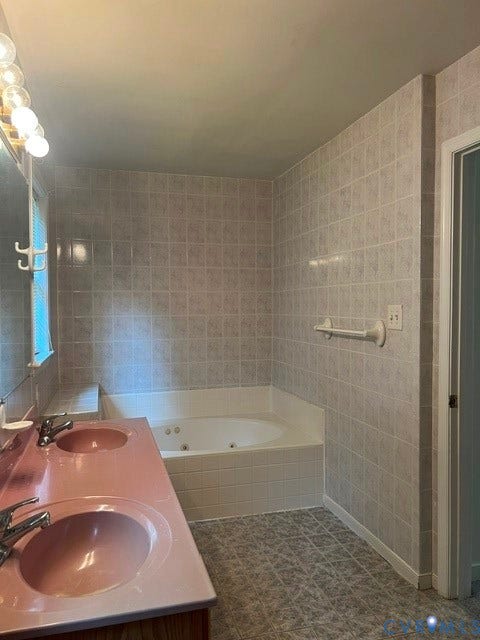 11419 Courthouse Acres Drive, Midlothian, VA 23114 Dual vanity with integrated sinks, jetted tub, and tiled walls