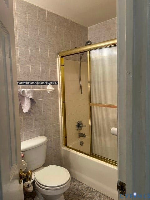 11419 Courthouse Acres Drive, Midlothian, VA 23114 Full bath featuring a tiled shower surround, integrated tub, and gold-tone shower door with fluted glass