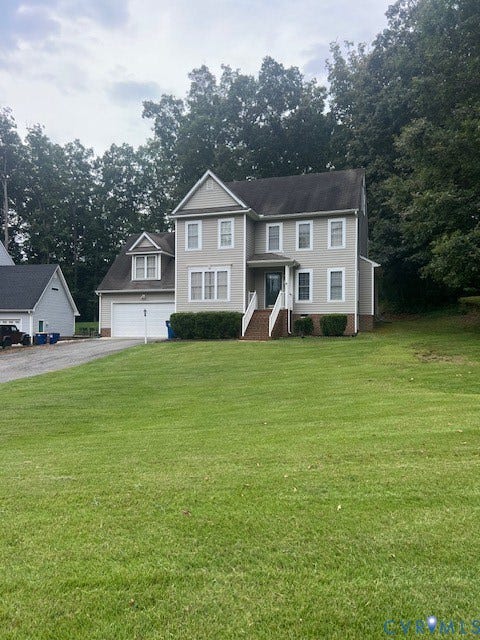 11419 Courthouse Acres Drive, Midlothian, VA 23114 Two-story home with light-colored siding, a covered front entry, and a two-car garage