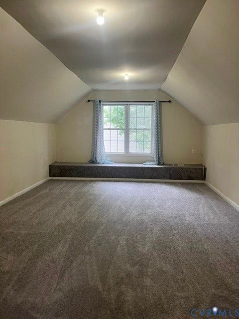 11419 Courthouse Acres Drive, Midlothian, VA 23114 Spacious room featuring vaulted ceilings, a window seat, and neutral-toned wall-to-wall carpeting