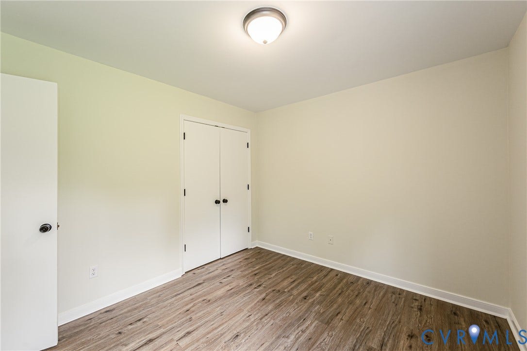 1520 Willow Brook Road, Louisa, VA 23024 LVP flooring, white walls, and a ceiling-mounted light fixture