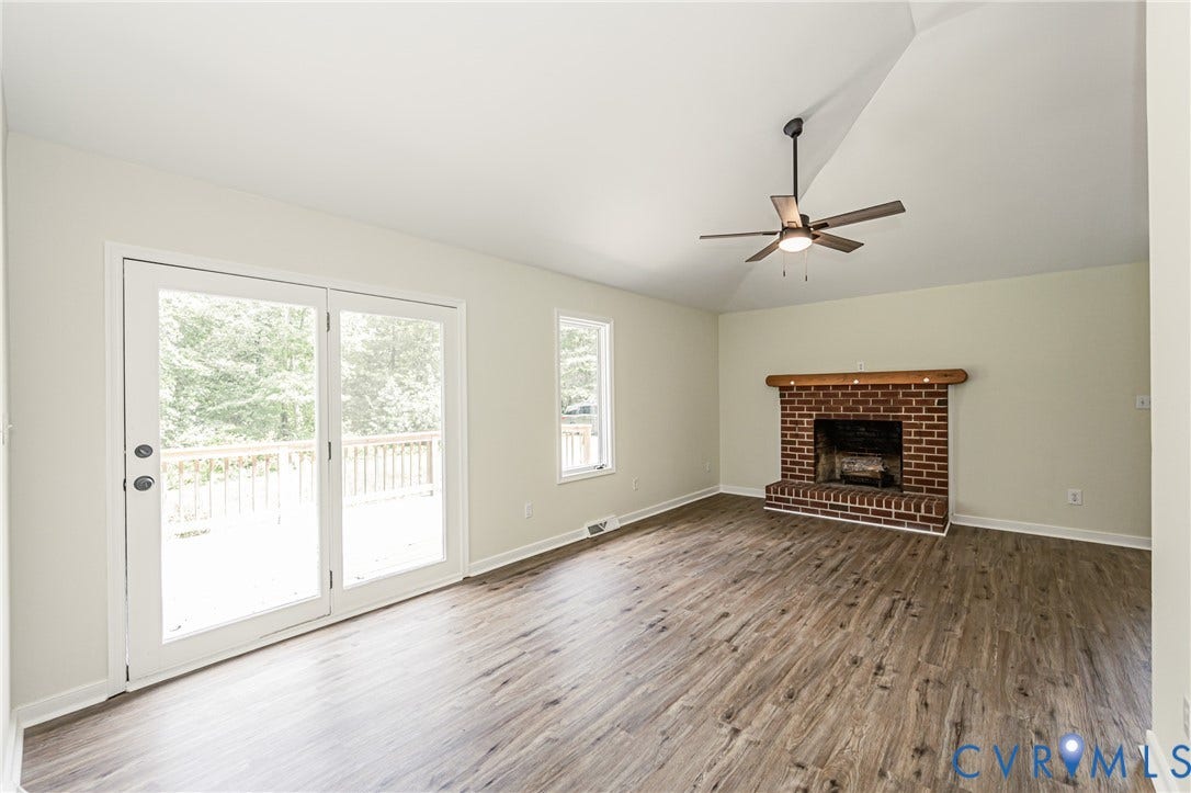 1520 Willow Brook Road, Louisa, VA 23024 Spacious room featuring vaulted ceilings, LVP flooring, and a ceiling fan with integrated lighting