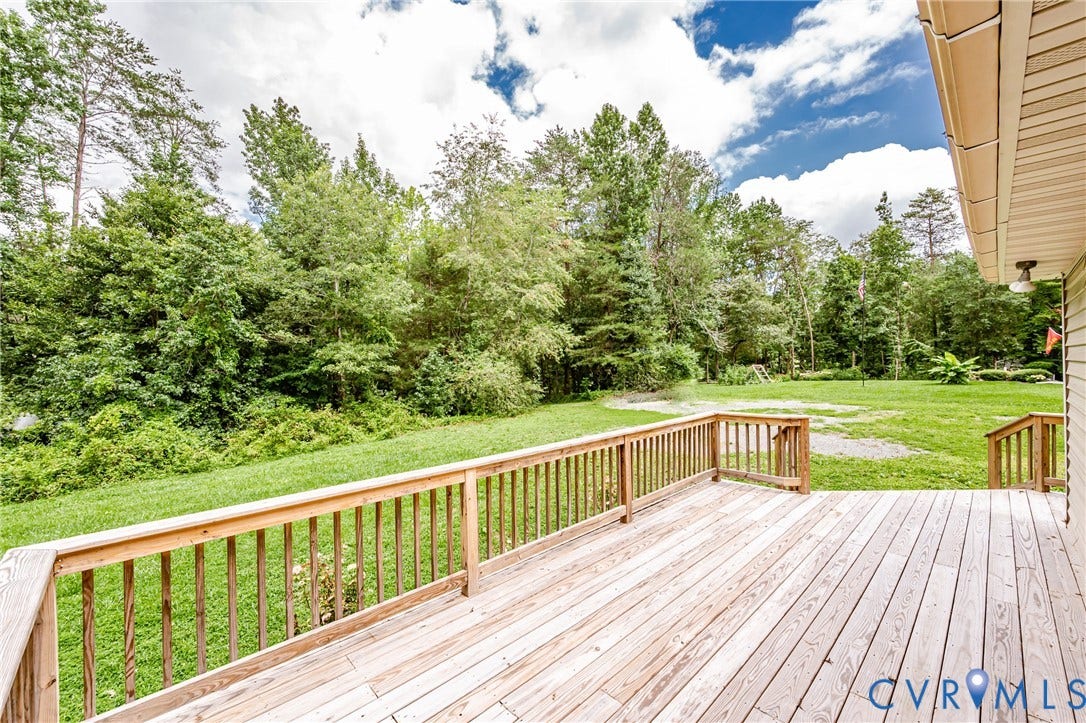 1520 Willow Brook Road, Louisa, VA 23024 Expansive wooden deck with railing, providing access to a large grass area