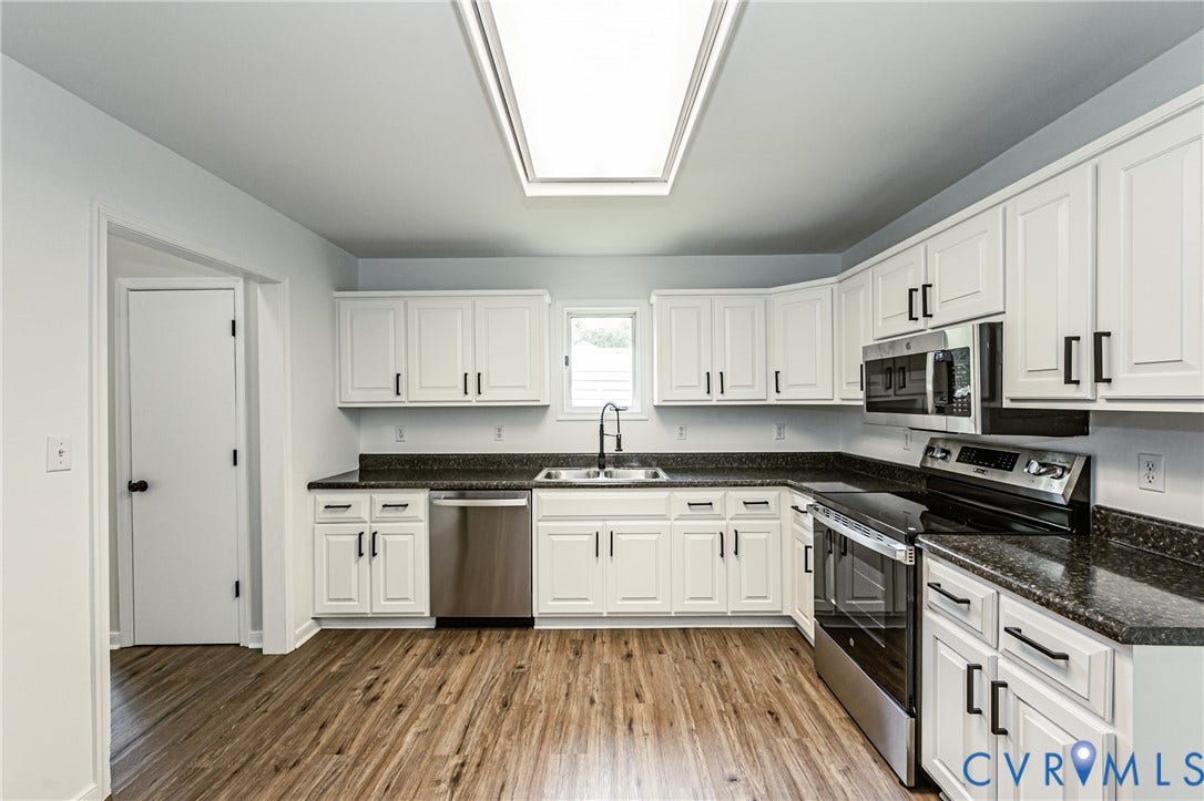1520 Willow Brook Road, Louisa, VA 23024 Kitchen featuring white cabinetry, dark laminate countertop, stainless steel appliances, and a recessed ceiling light