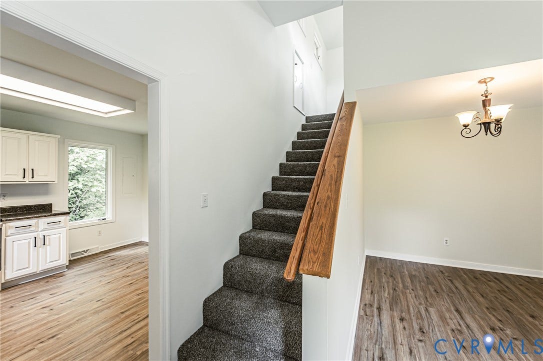 1520 Willow Brook Road, Louisa, VA 23024 Carpeted staircase with a wood handrail