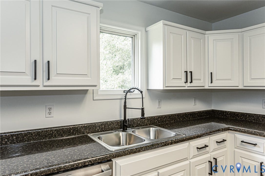 1520 Willow Brook Road, Louisa, VA 23024 Double basin stainless steel sink with a black pull-down faucet