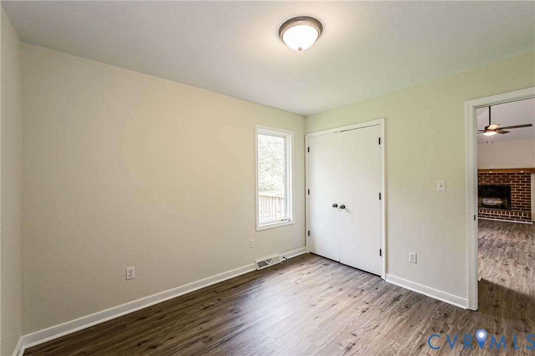 1520 Willow Brook Road, Louisa, VA 23024 LVP flooring, white trim, recessed window, and a built-in closet with double doors