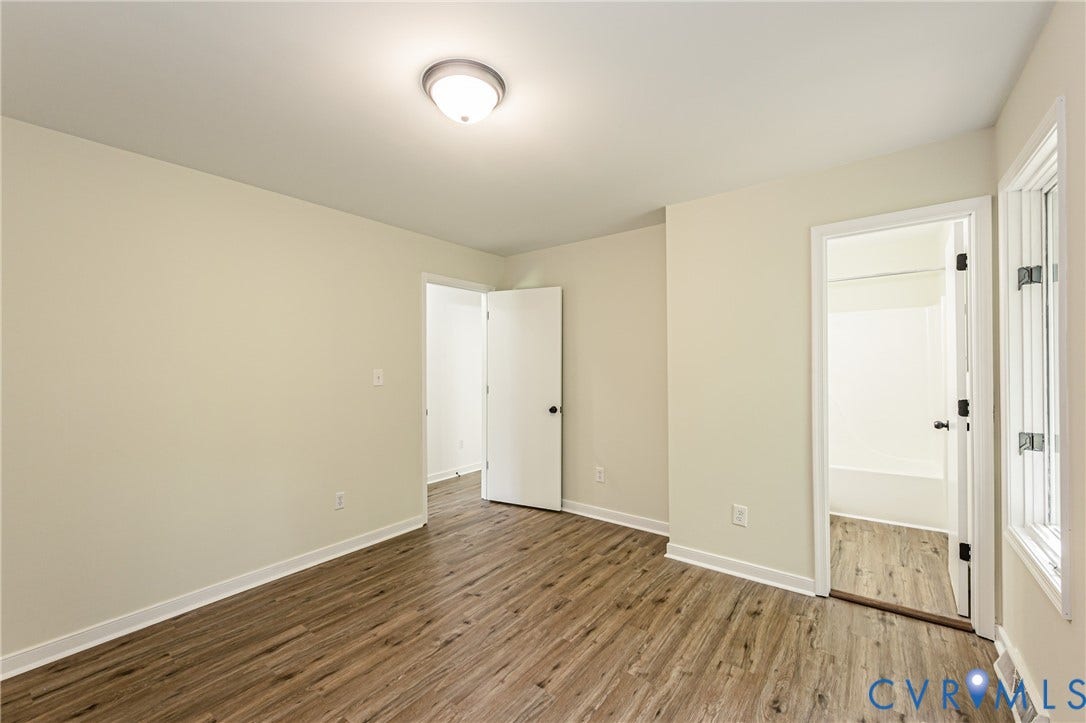 1520 Willow Brook Road, Louisa, VA 23024 LVP flooring throughout, neutral painted walls, white trim, and a flush mount ceiling light