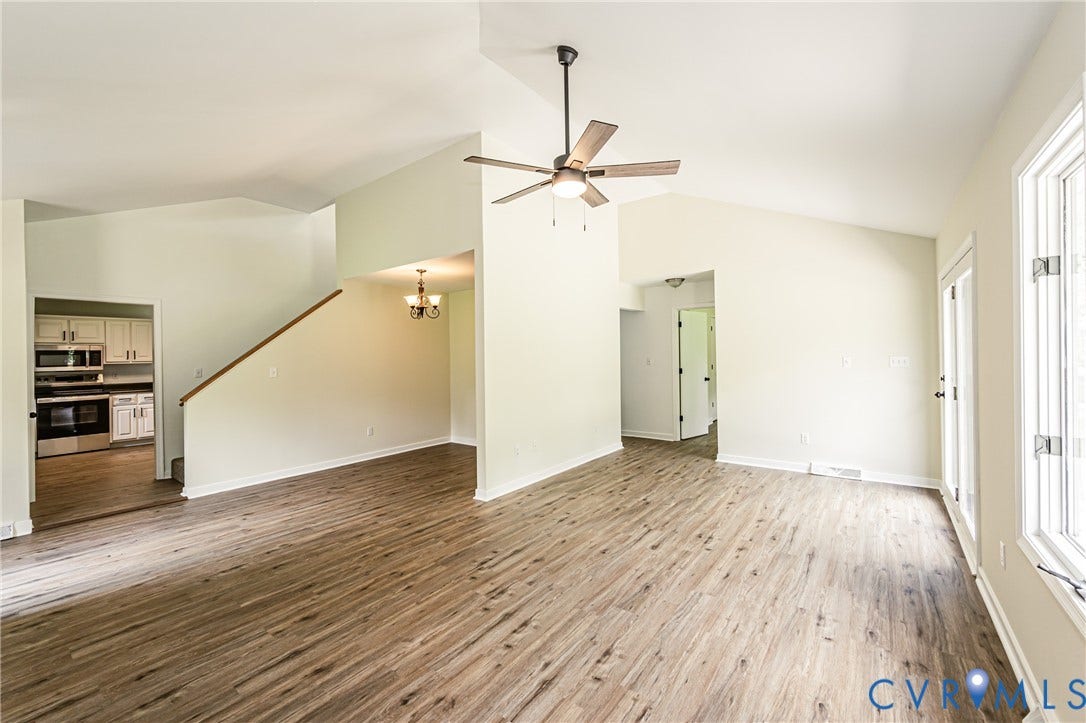 1520 Willow Brook Road, Louisa, VA 23024 Vaulted ceilings featuring a ceiling fan, wood-finish flooring, white trim, and a glass-paneled door