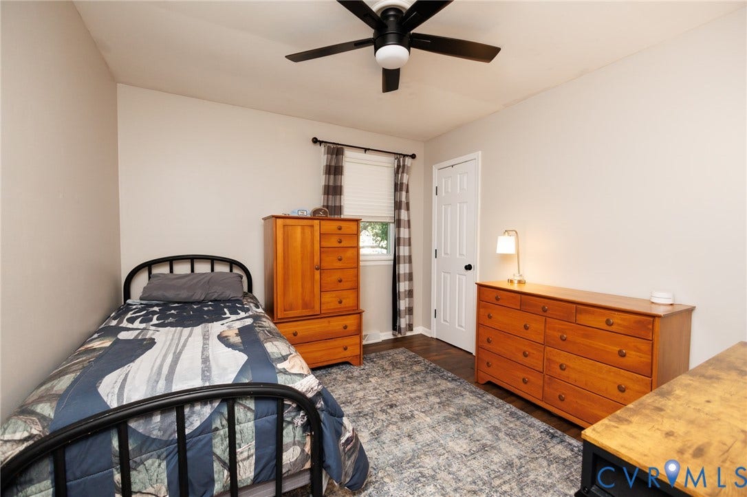 15525 Saddlebrook Road, Chesterfield, VA 23838 Wood-finish flooring with a subtle sheen, a white paneled door, and a ceiling fan with black blades