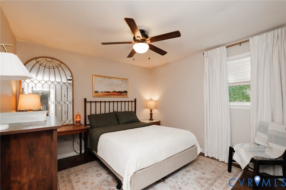 15525 Saddlebrook Road, Chesterfield, VA 23838 Wood-finish flooring with a ceiling fan and a window featuring blinds