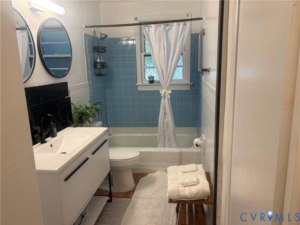 2443 Tignor Road, Richmond, VA 23224 Modern vanity with an integrated sink and matte black faucet