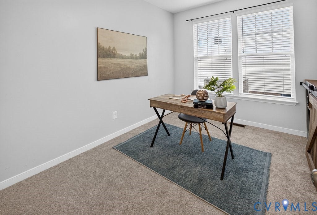 7401 Nicklaus Circle, Moseley, VA 23120 Two large windows with blinds, light gray wall color, and carpeted flooring