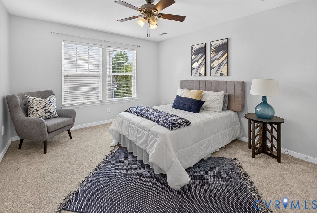 7401 Nicklaus Circle, Moseley, VA 23120 Bedroom 2 - Carpeting throughout, two windows with blinds, and a ceiling fan with light fixture