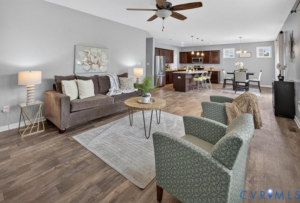 7401 Nicklaus Circle, Moseley, VA 23120 Open-concept living space with LVP , a ceiling fan, and recessed lighting.