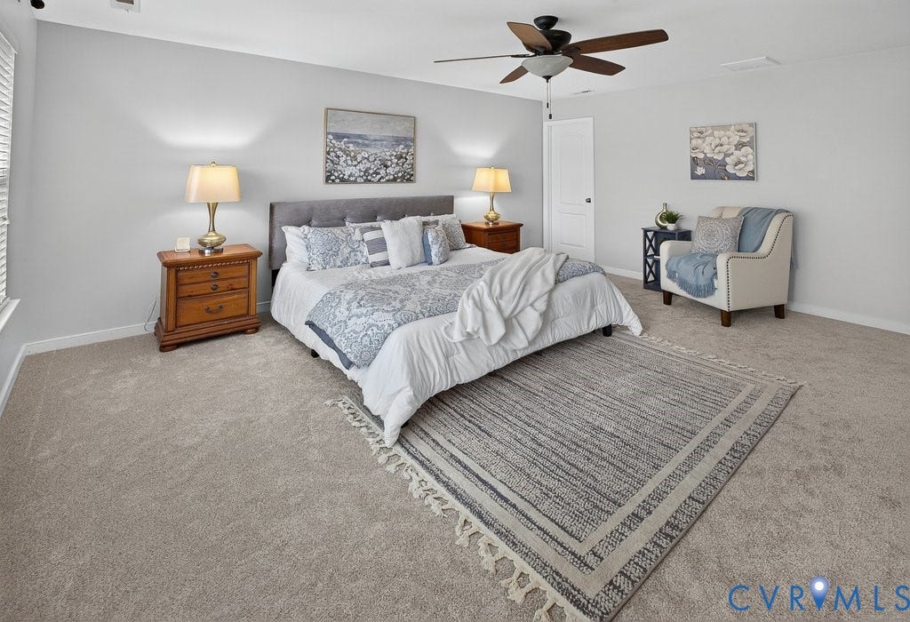 7401 Nicklaus Circle, Moseley, VA 23120 Carpeted room with a ceiling fan, window with blinds, and a white door