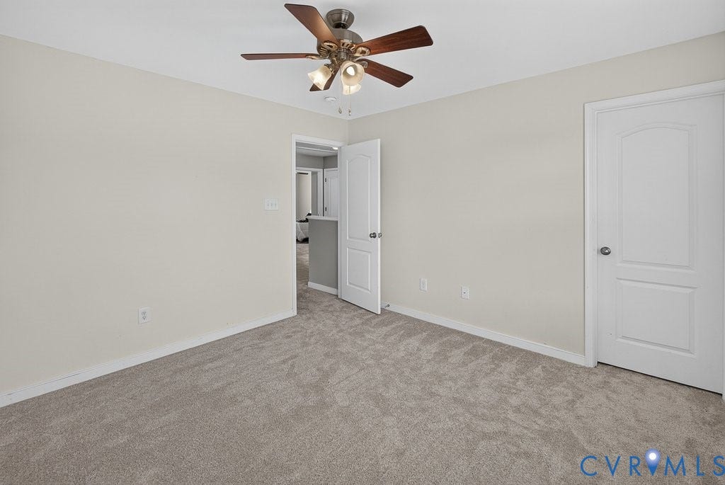 7401 Nicklaus Circle, Moseley, VA 23120 Bedroom 4 - Light gray wall paint, neutral carpet flooring, ceiling fan with integrated lighting, and white paneled doors