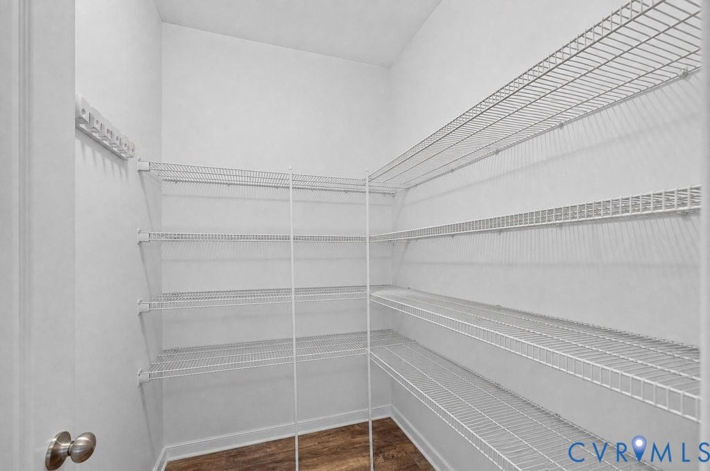 7401 Nicklaus Circle, Moseley, VA 23120 Large walk-in Pantry featuring extensive wire shelving, white painted walls, and LVP.