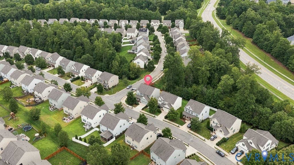 7401 Nicklaus Circle, Moseley, VA 23120 Residential community featuring a variety of detached homes, mature tree lines, and paved streets