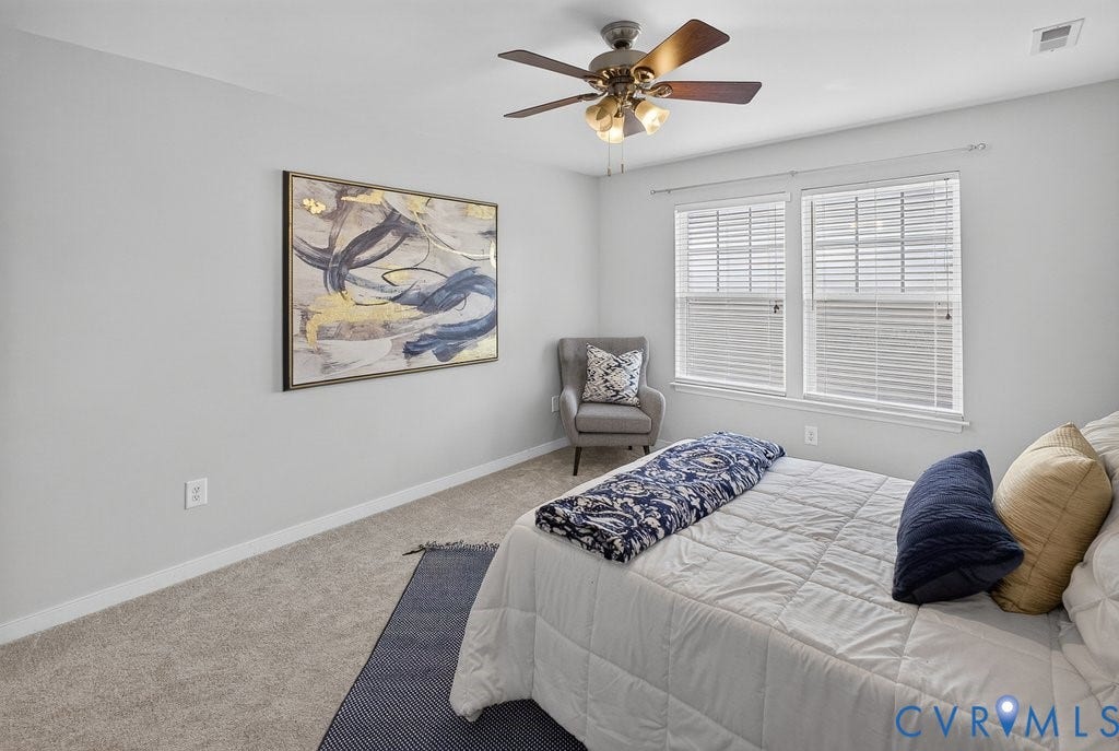 7401 Nicklaus Circle, Moseley, VA 23120 Wall-to-wall carpeting, two windows with blinds, a ceiling fan with integrated lighting, and light-colored walls