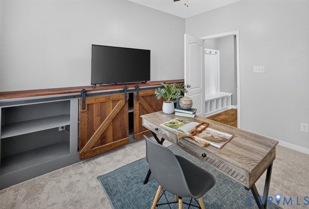7401 Nicklaus Circle, Moseley, VA 23120 Built-in media console with wood-finish barn doors, wood-finish countertop, and integrated shelving