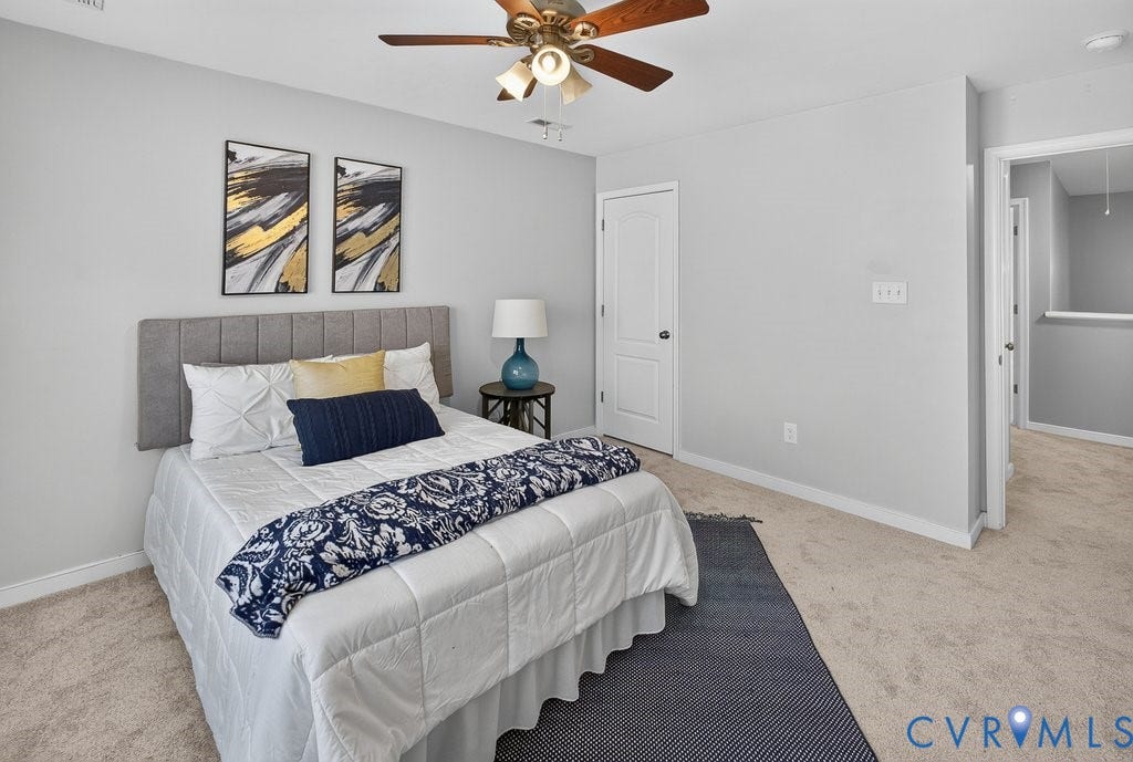 7401 Nicklaus Circle, Moseley, VA 23120 Neutral-toned walls, plush carpeting, and a ceiling fan with integrated lighting