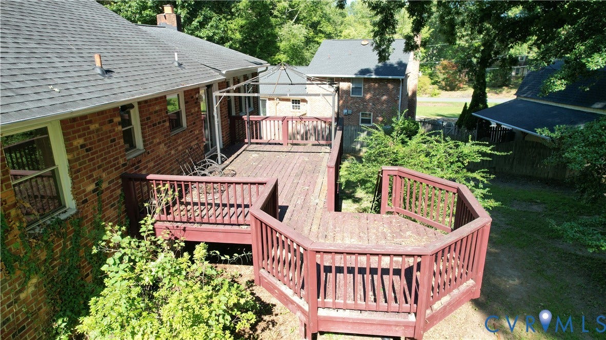 9018 Brucewood Drive, Midlothian, VA 23235 Expansive multi-level wood deck with a gazebo frame, brick exterior, and a shingle roof
