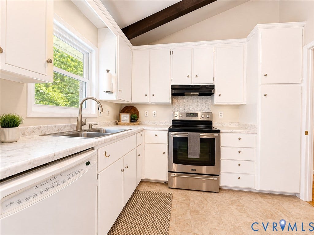 9018 Brucewood Drive, Midlothian, VA 23235 Kitchen featuring white cabinetry, a stainless steel range with overhead ventilation, a dual basin stainless steel sink with a gooseneck faucet, light-toned countertops, and exposed ceiling beams