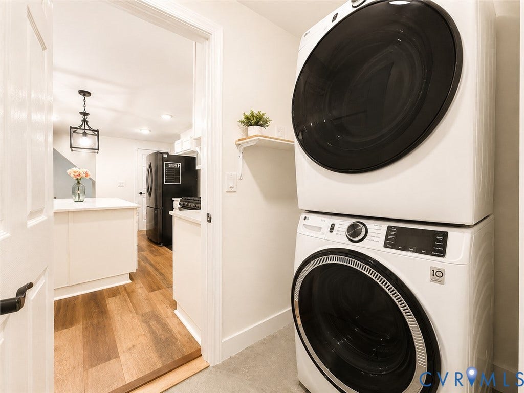 9018 Brucewood Drive, Midlothian, VA 23235 Laundry area with stacked washer and dryer unit