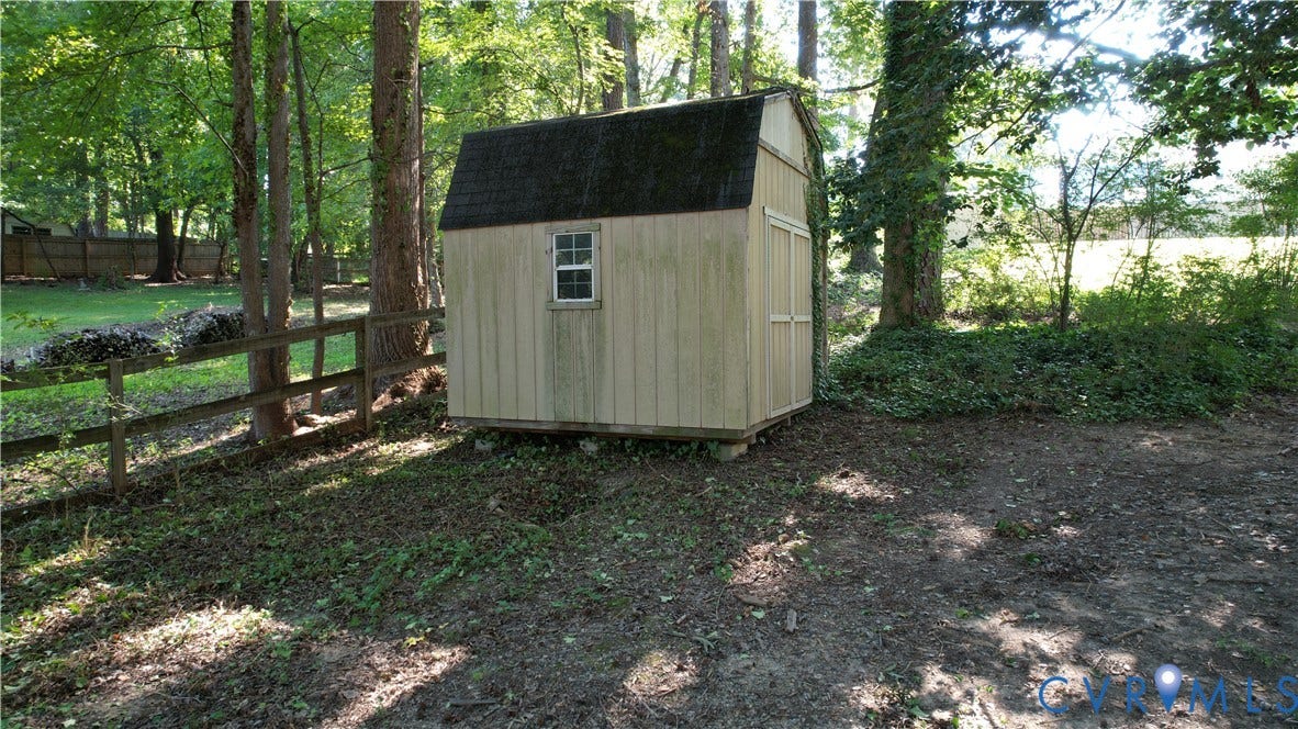 9018 Brucewood Drive, Midlothian, VA 23235 Detached storage shed with a gambrel roof and single window