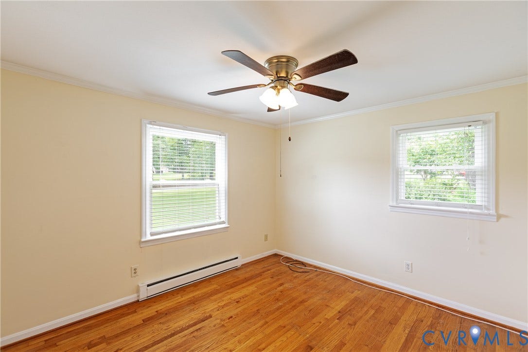 2730 Kinvan Road, Henrico, VA 23231 Hardwood flooring, two windows with blinds, ceiling fan with light fixture, and crown molding