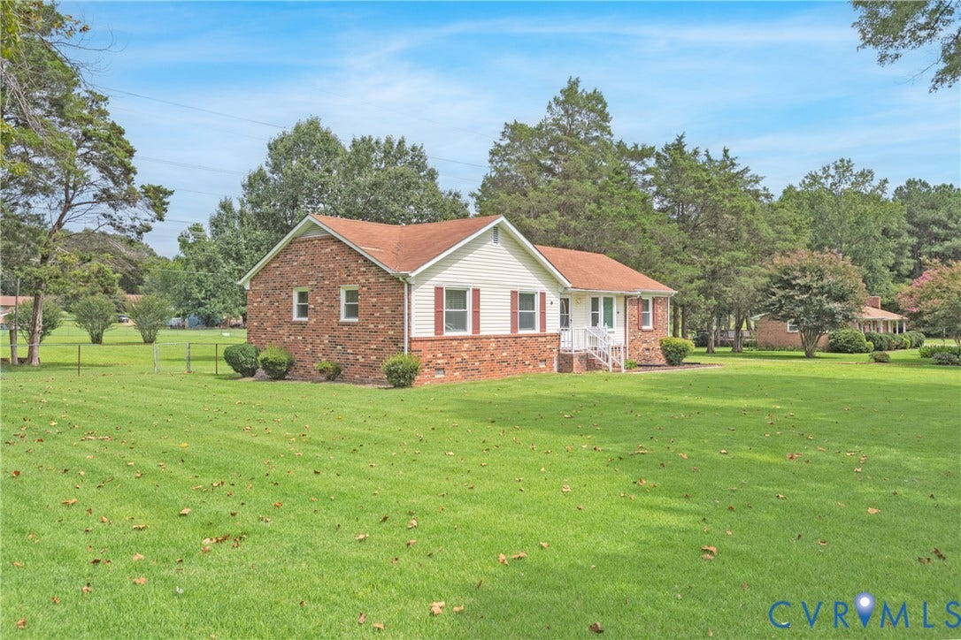 2730 Kinvan Road, Henrico, VA 23231 Brick and siding exterior with a red shingle roof, complemented by a expansive front lawn and mature trees