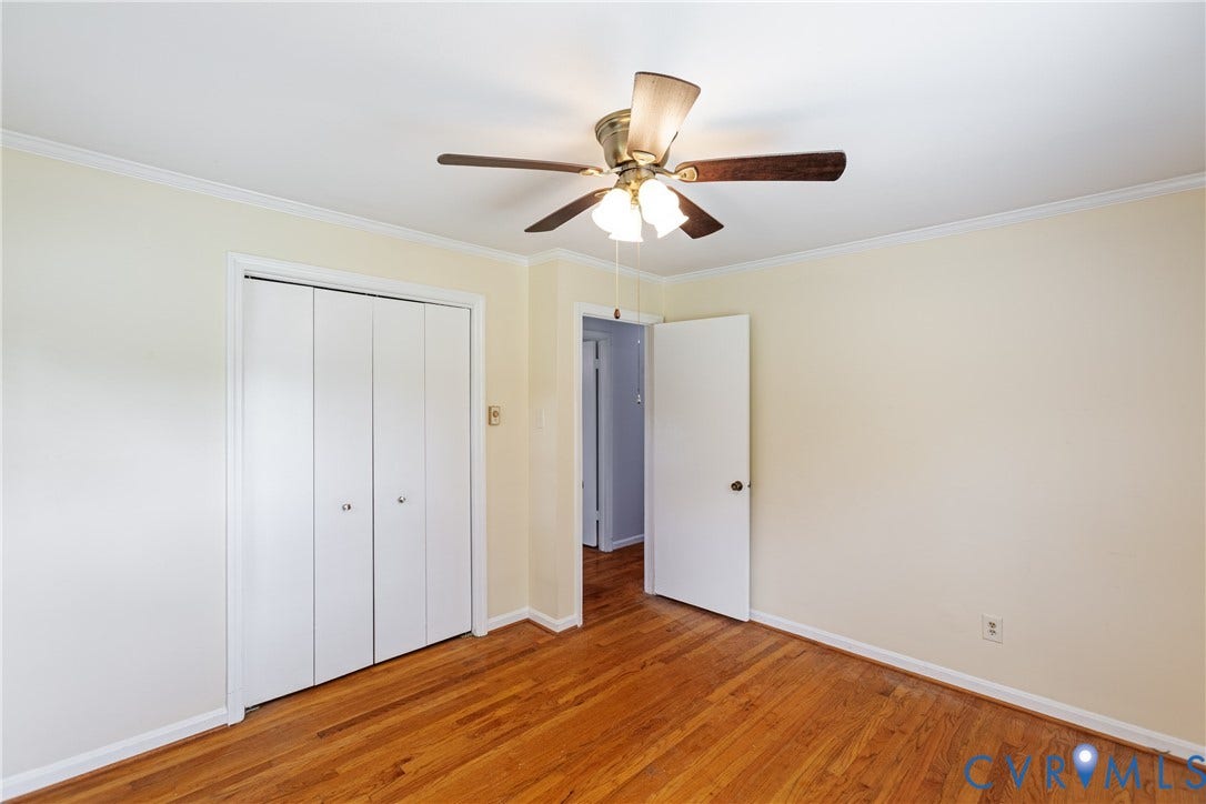 2730 Kinvan Road, Henrico, VA 23231 Wood-finish flooring, bi-fold closet, ceiling fan with light fixture, and white trim