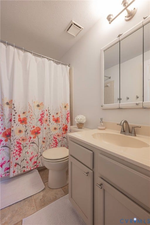 Modern vanity with under-sink storage, integrated sink, and brushed nickel faucet