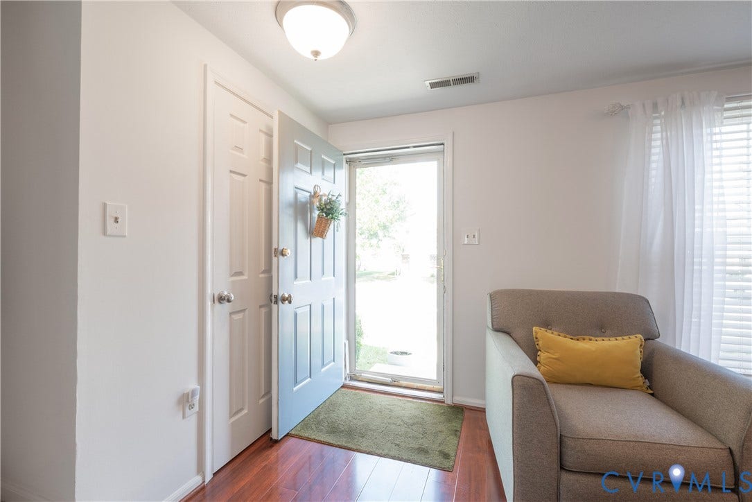 Entry with storm door and coat closet