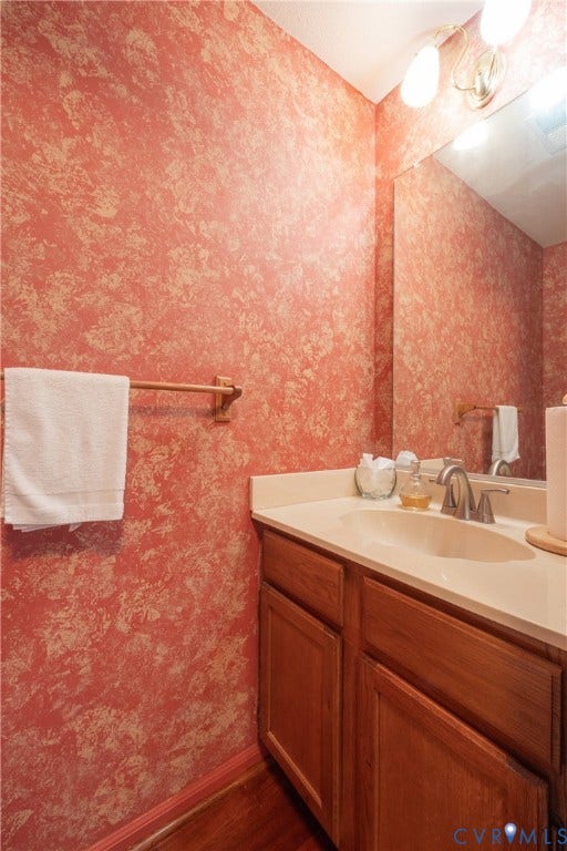 Wood-finish vanity with a built-in sink and countertop