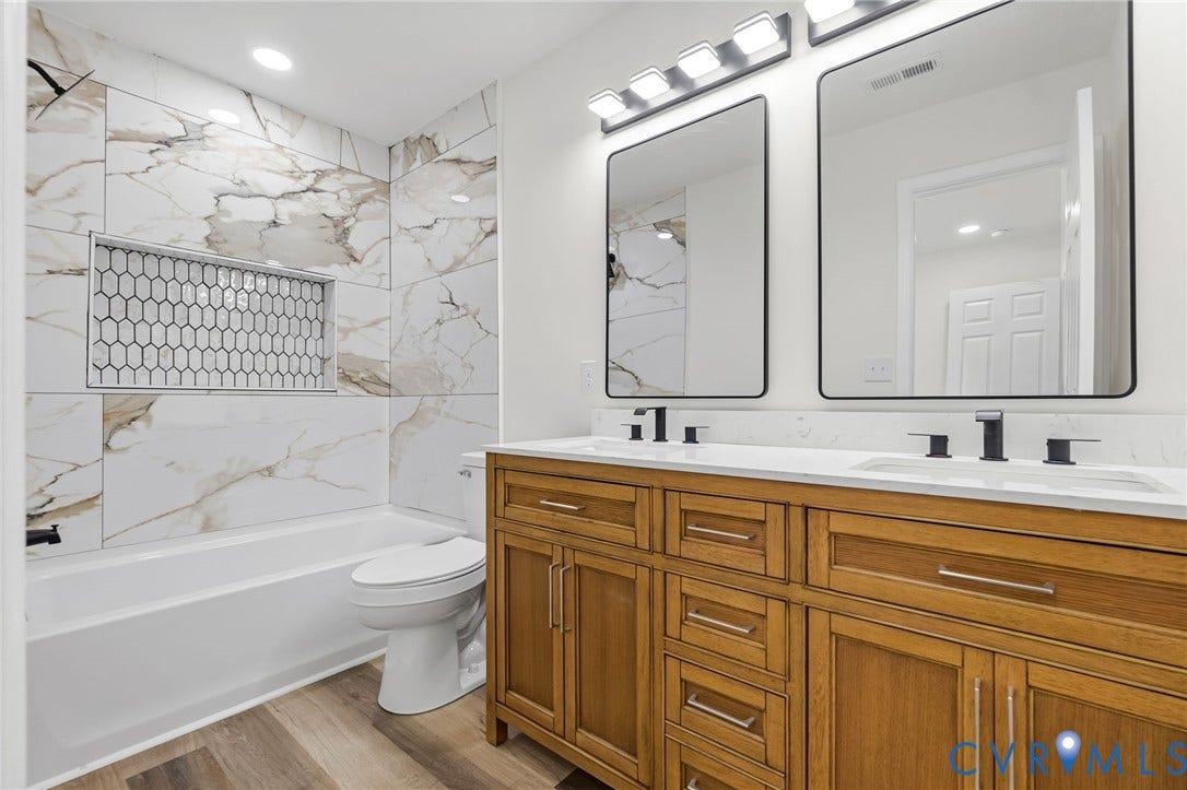 516 S South Street, Myers, Petersburg, VA 23803 Dual vanity with a white countertop and matte black fixtures