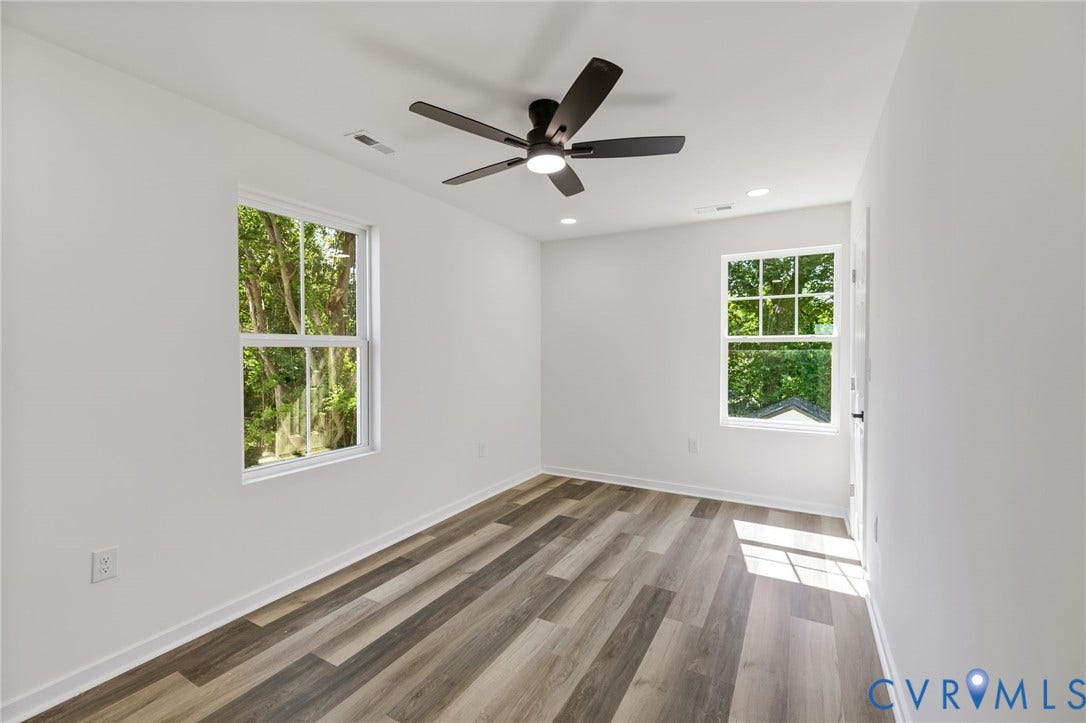 516 S South Street, Myers, Petersburg, VA 23803 Wood-finish flooring, white walls, and a ceiling fan with integrated lighting