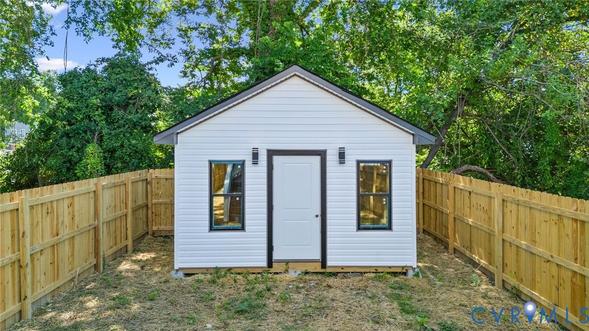 516 S South Street, Myers, Petersburg, VA 23803 Freestanding structure with white horizontal siding and a dark gabled roof