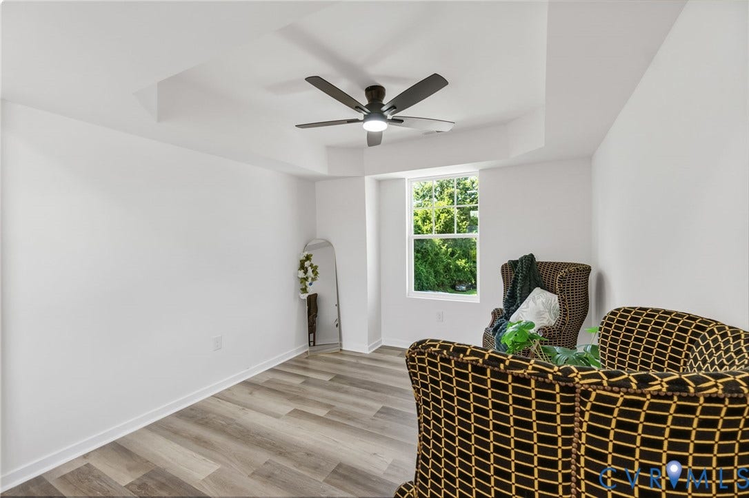 516 S South Street, Myers, Petersburg, VA 23803 Recessed ceiling with integrated ceiling fan, large window, and wood-finish flooring