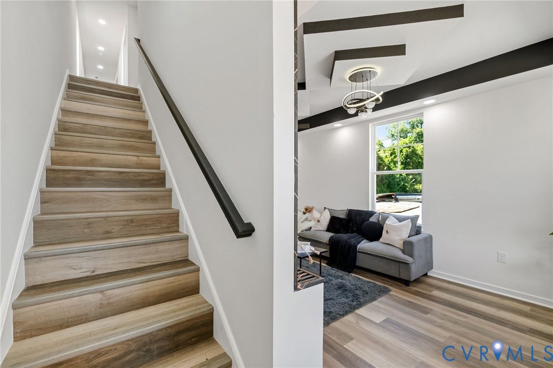 516 S South Street, Myers, Petersburg, VA 23803 Wood-finish flooring, recessed lighting, contemporary ceiling fixture, large window, and black ceiling accents