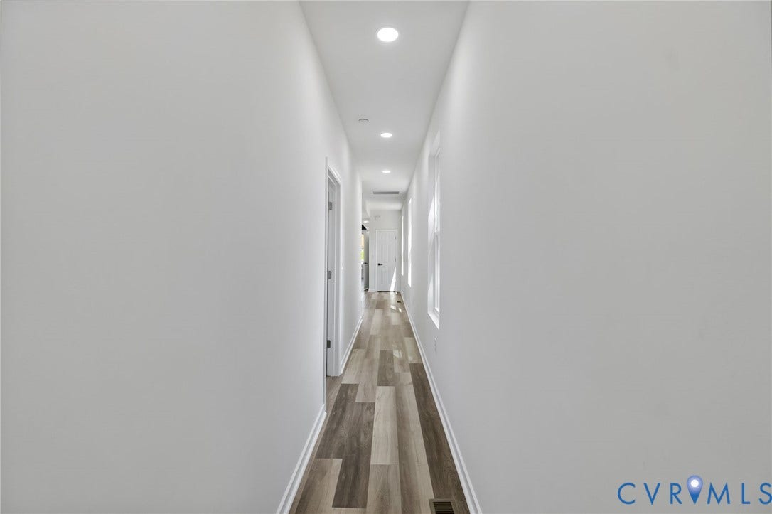 516 S South Street, Myers, Petersburg, VA 23803 Recessed lighting illuminating a hallway with wood-finish flooring