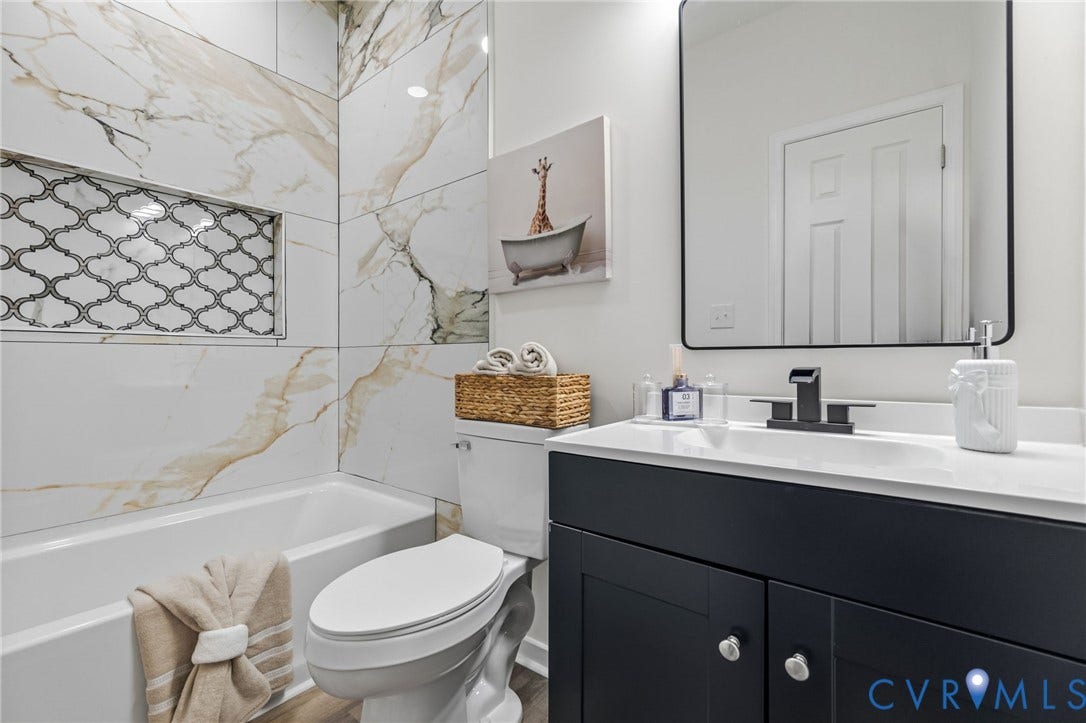516 S South Street, Myers, Petersburg, VA 23803 Modern vanity with a white countertop and matte black faucet