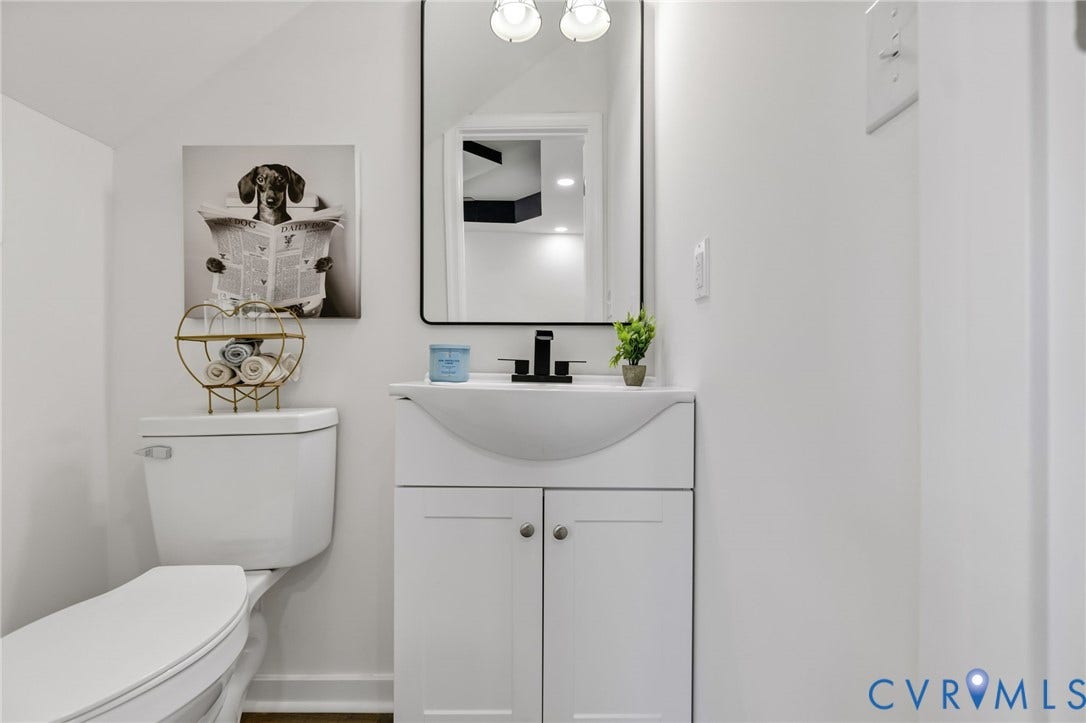 516 S South Street, Myers, Petersburg, VA 23803 Modern vanity with integrated sink, matte black faucet, and cabinet storage