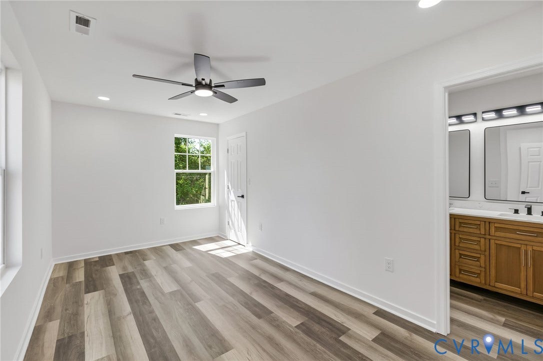 516 S South Street, Myers, Petersburg, VA 23803 Wood-finish flooring, recessed lighting, ceiling fan, and ample natural light through a large window